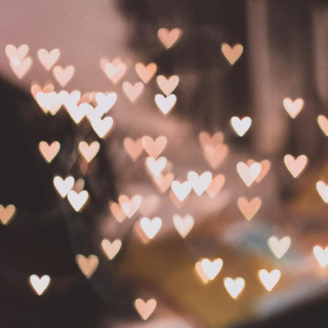 Heart-shaped bokeh lights in a soft blurred Valentine's Day background